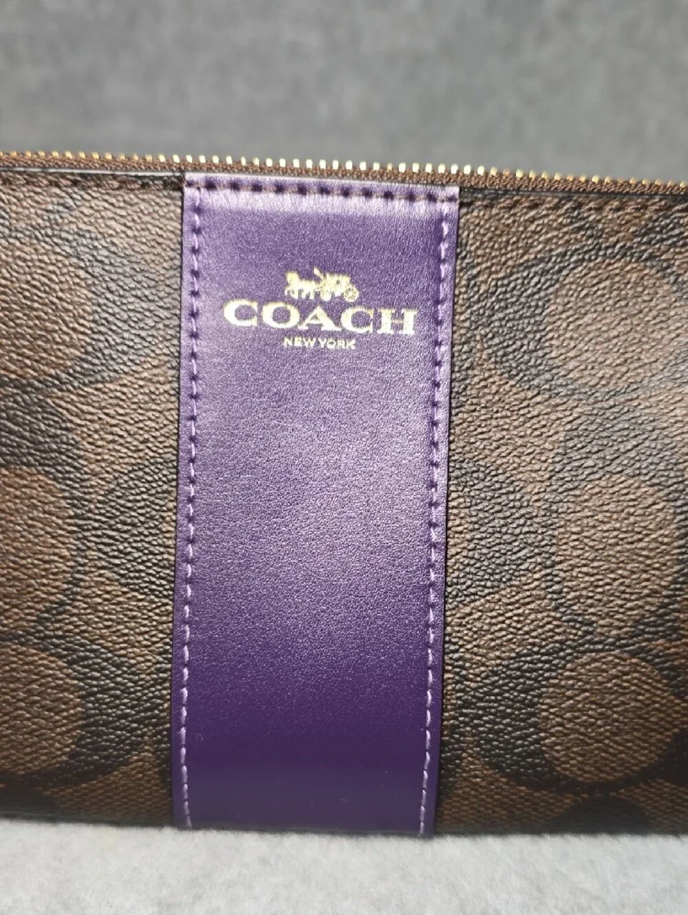 Coach Brown Signature Coated Canvas Wristlet with Purple Leather Center Stripe